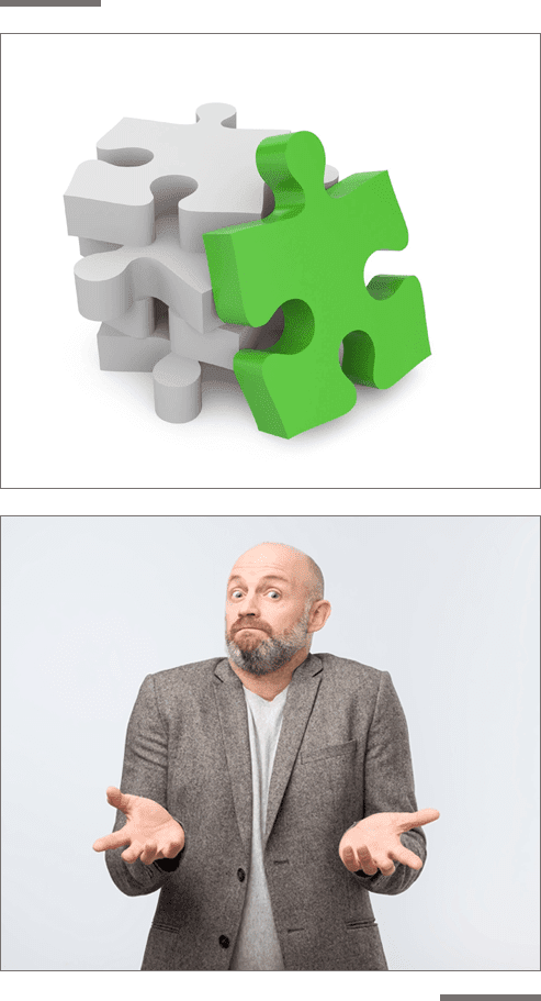 A man in grey jacket and green puzzle piece.
